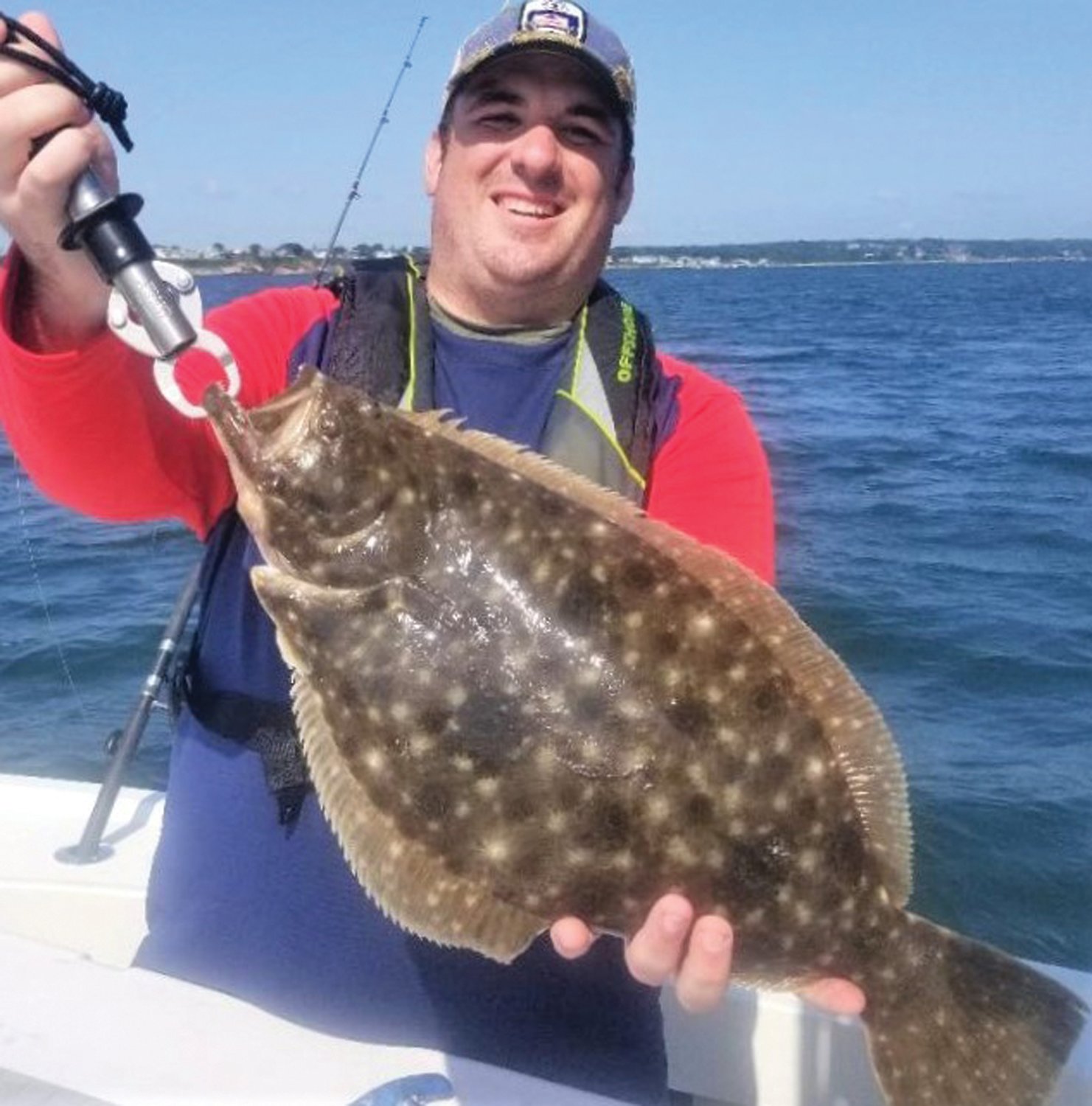 BIG FLUKE: Jake Howard of Minnesota with his first ever summer flounder, a 22-inch fluke caught at Austin Hollow, Jamestown, drifting down the bank in 65 feet of water.